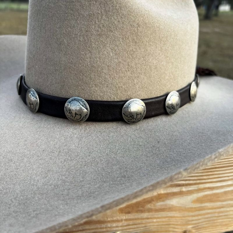 I love the feather hat accessories so much so I just had to make one of my  own! Leather cord (I added the silver ends) and a buffalo nickel concho.  The black