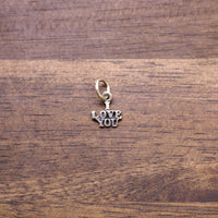 Sterling silver charm reading LOVE YOU