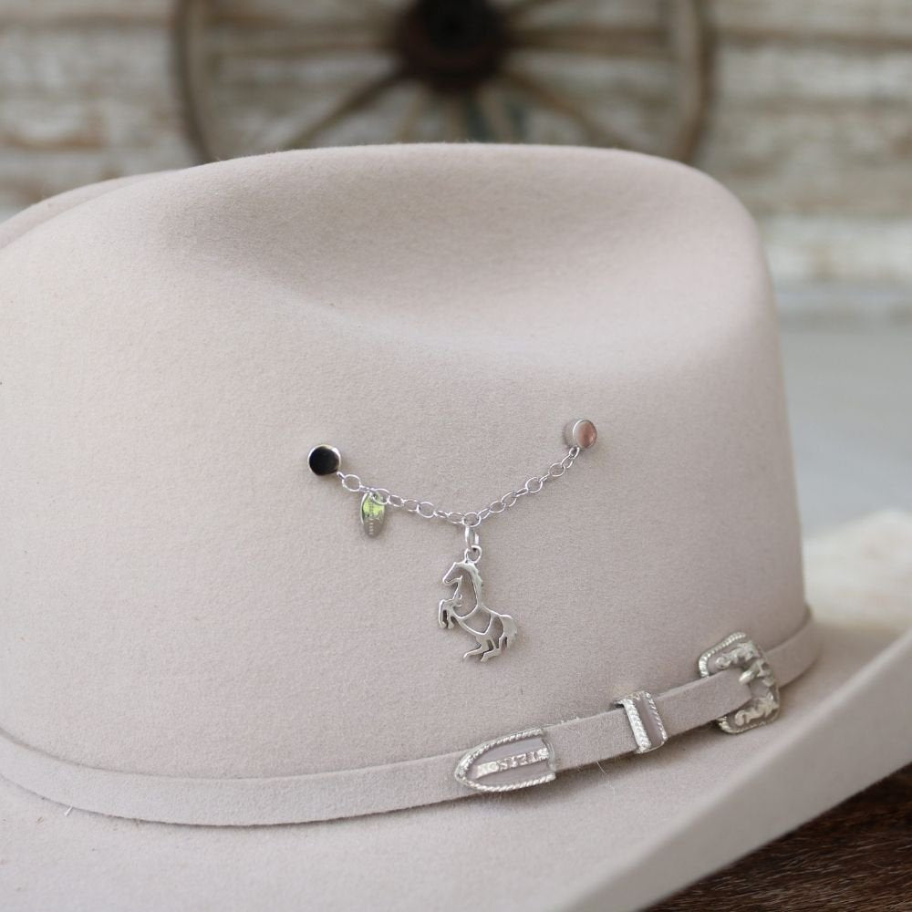 Sterling silver rearing horse charm on a delicate chain with small green beads
