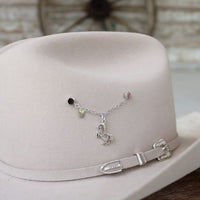 Sterling silver rearing horse charm on a delicate chain with small green beads