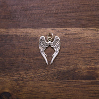 Sterling silver angel wings charm with heart center and loop bail