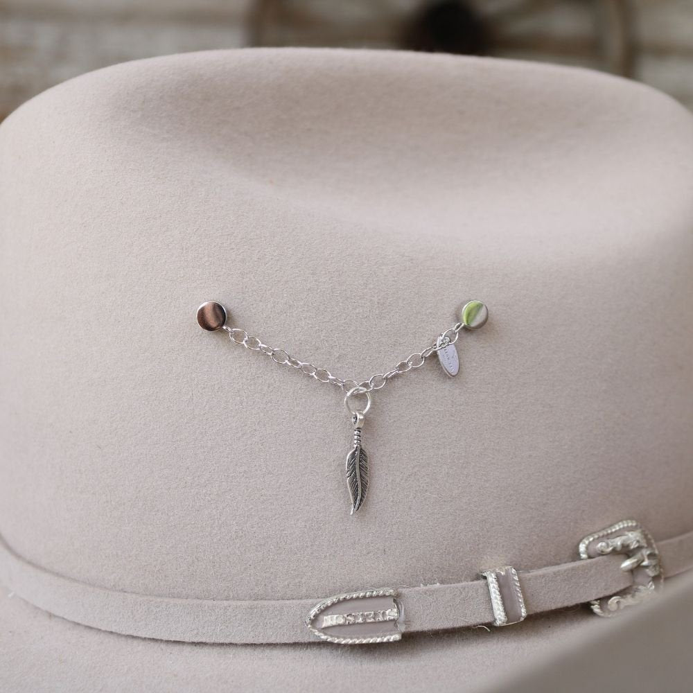 Sterling silver charm necklace with feather pendant and small dangling beads