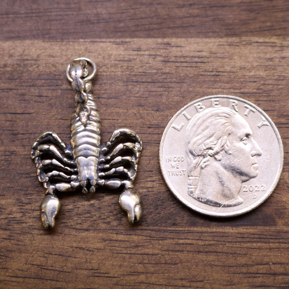 Sterling silver scorpion pendant, detailed legs and ridged tail with loop bail