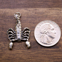 Sterling silver scorpion pendant, detailed legs and ridged tail with loop bail