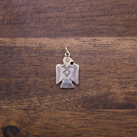 Sterling silver Thunderbird charm pendant with cutout wings and loop bail