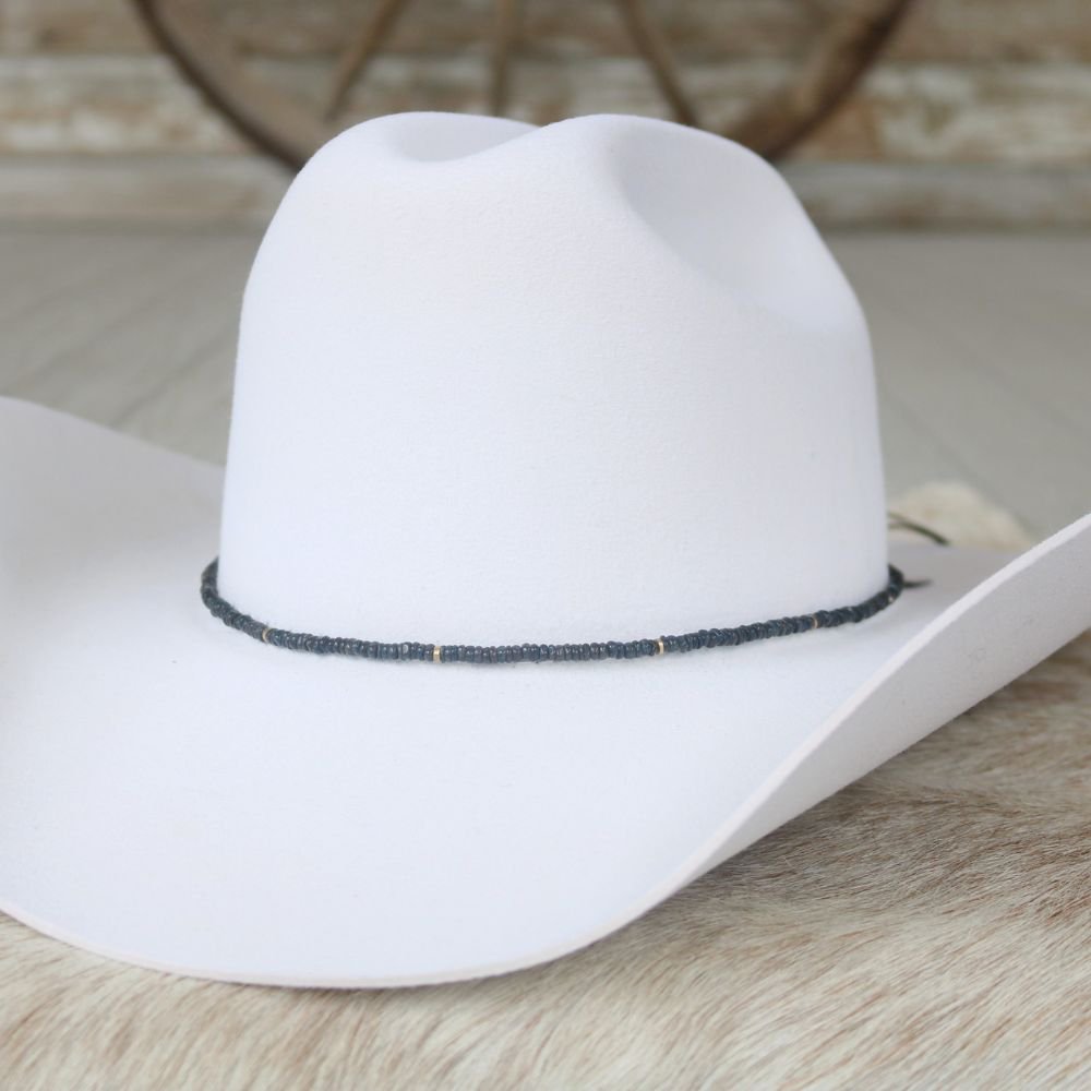 Cleo beaded hat band on white felt hat, black beaded strip with thin blue highlights