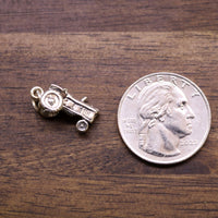 Sterling silver tractor charm with detailed cab and small wheels