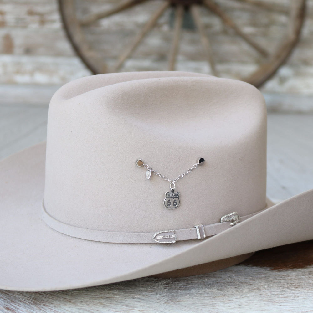 Sterling silver charm necklace with Texas Route 66 shield on white cowboy hat