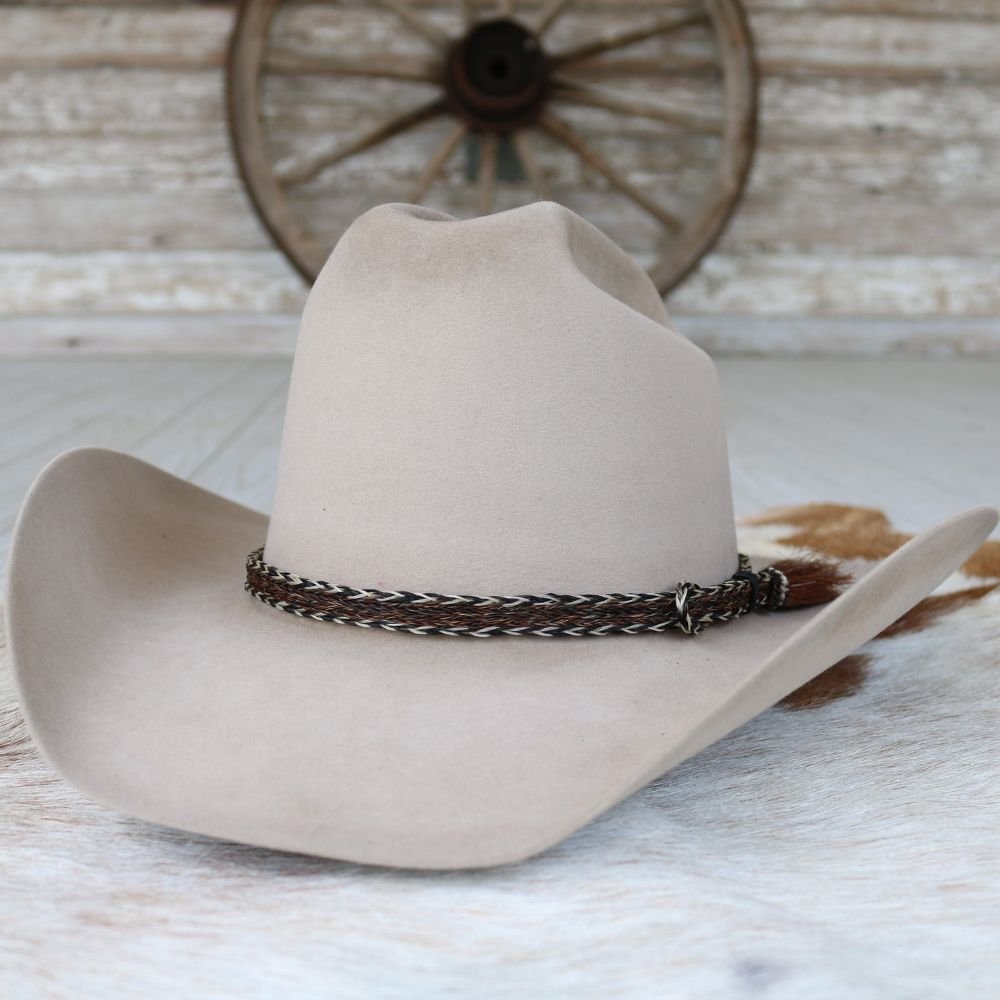 Beige felt cowboy hat with dark braided hat band and single side tassel