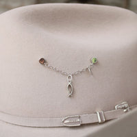 Sterling silver charm bracelet with fish charm, cross, and wing charms