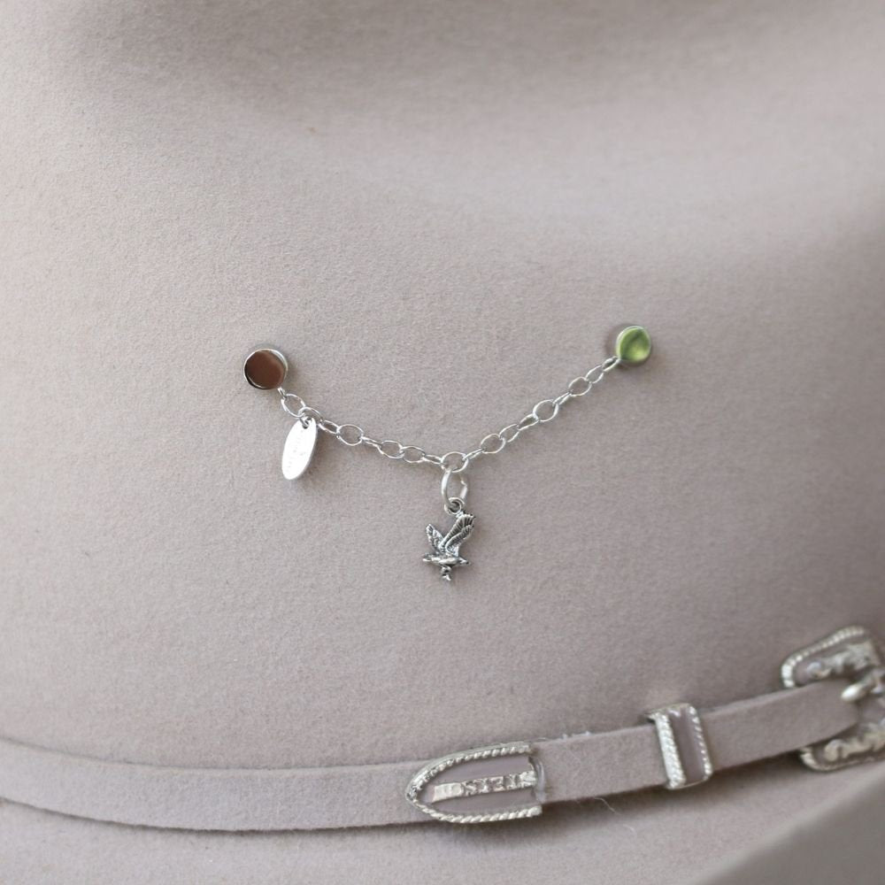 Silver chain necklace with eagle charm centerpiece and small green bead