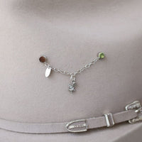 Silver chain necklace with eagle charm centerpiece and small green bead