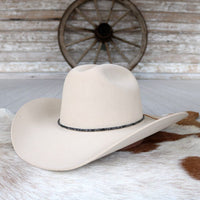 Cream felt hat with dark beaded stone hat band around brim