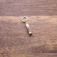 Sterling silver fish charm pendant with small stamped details