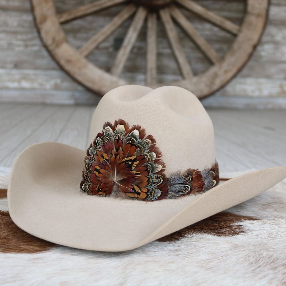 Western feather hat band on light tan felt hat with multicolor feather centerpiece