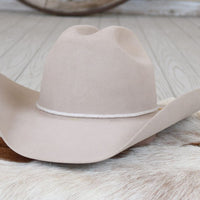 Light beige wide-brim cowboy hat with curved brim and creased crown