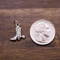 Sterling silver boot charm pendant with loop bail, shown next to coin