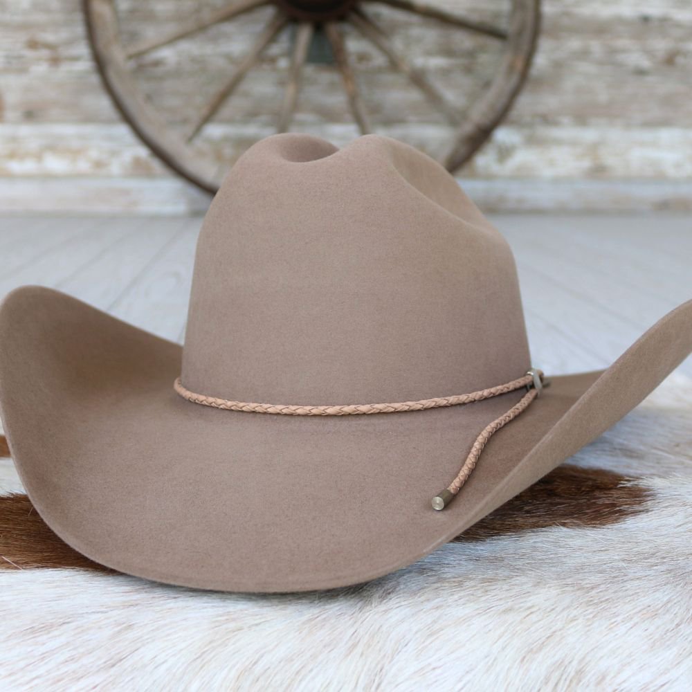 Tan cowboy hat with tan braided leather hat band around the crown