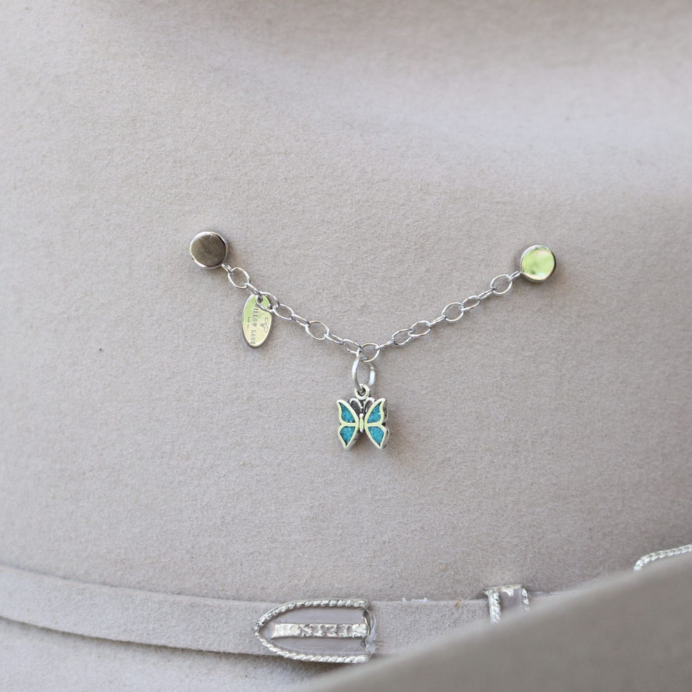 Sterling silver charm bracelet with dangling butterfly charm and small enamel accents
