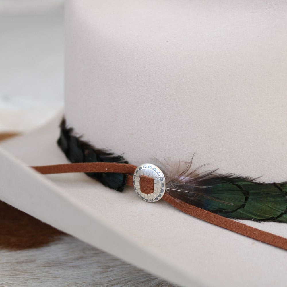 Sterling silver slotted concho with round center detail on brown leather strap