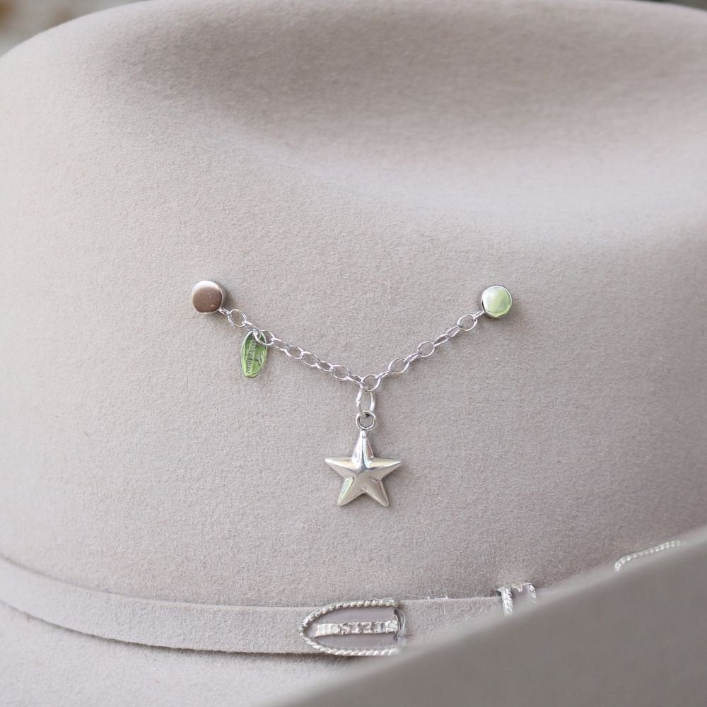 Sterling silver star charm on a dainty bracelet with small colored beads