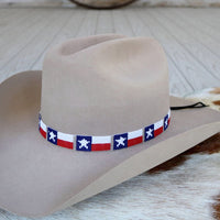 Beaded hat band with Texas flag pattern, red white blue, on tan cowboy hat