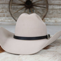 Light tan cowboy hat with black leather hat band and side buckle