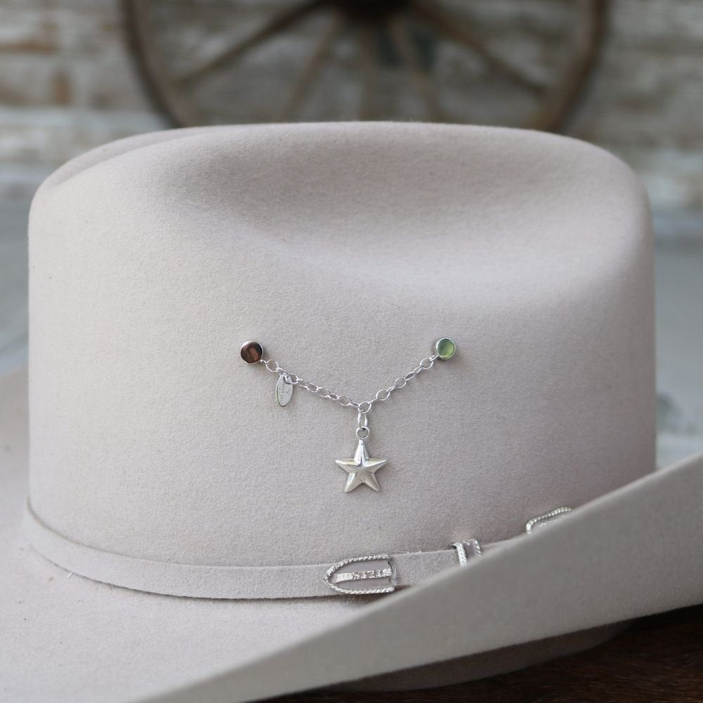 Sterling silver star charm on a delicate bracelet with colored bead accents