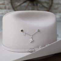 Sterling silver star charm on a delicate bracelet with colored bead accents