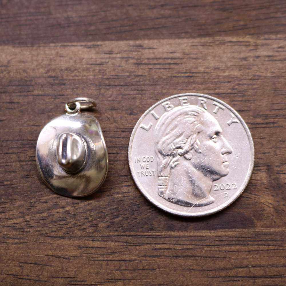 Sterling silver cowboy hat charm pendant, domed round shape with hat engraving.