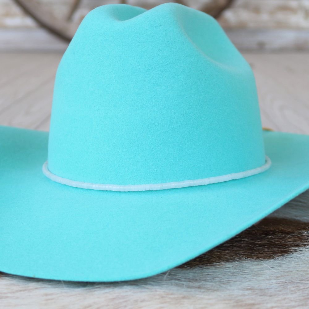 Turquoise wide-brim cowboy hat with curved brim and creased crown