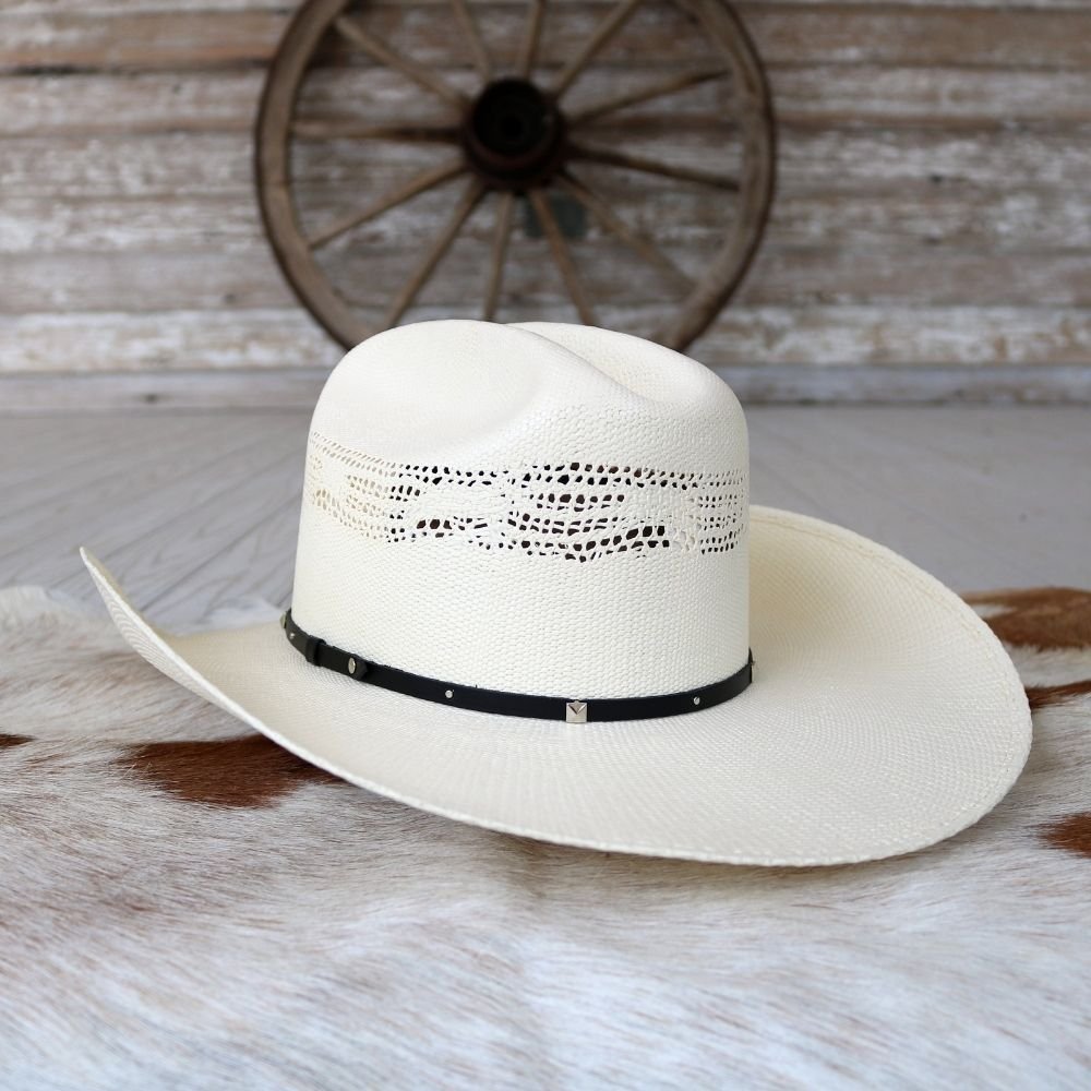 Stetson white straw cowboy hat, side view, perforated band and black hatband