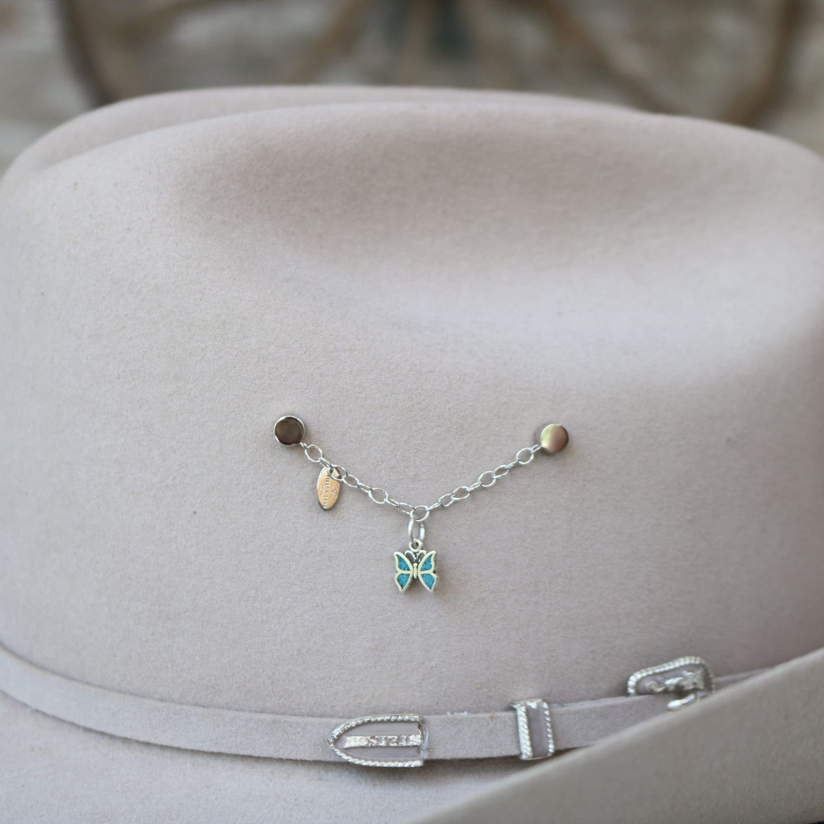 Sterling silver butterfly charm bracelet with blue enamel butterfly and green enamel accent