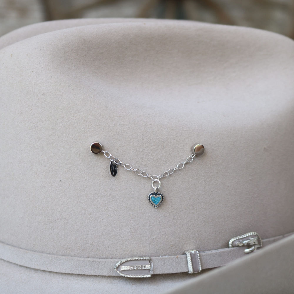 Turquoise heart inlay charm bracelet with small dark charm and heart pendant