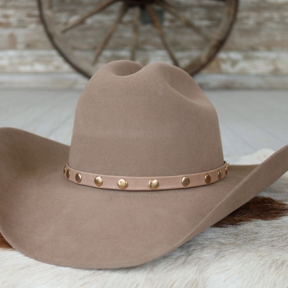 Taupe felt cowboy hat with gold studded leather band, side angle
