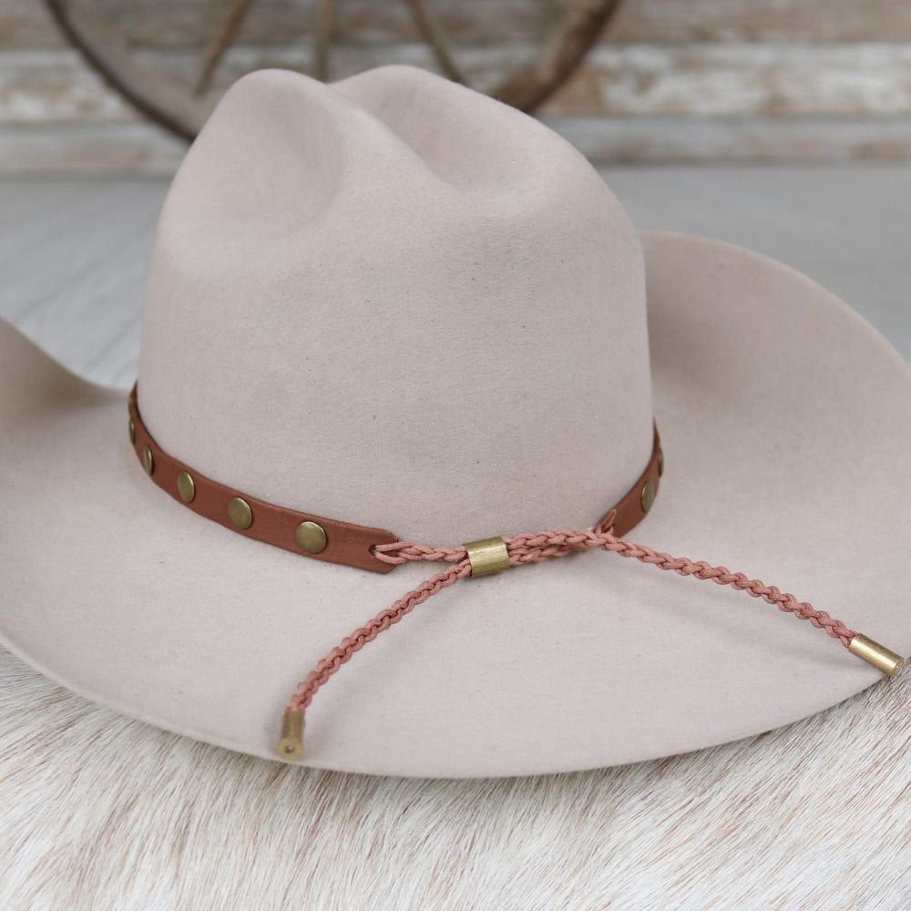 Studded medium-brown leather hat band with braided cord tie and brass tips