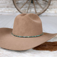 Brown felt cowboy hat with turquoise beaded hat band