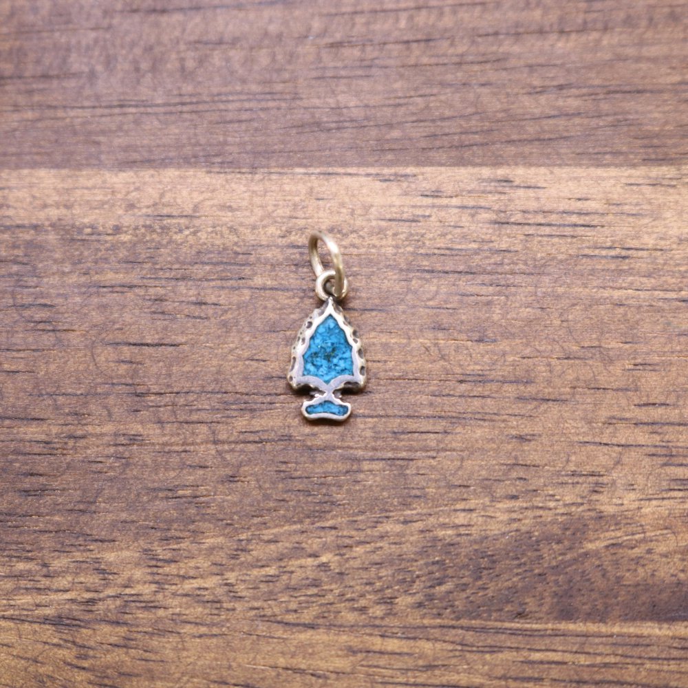 Turquoise inlay arrowhead charm with silver bail, blue drop design
