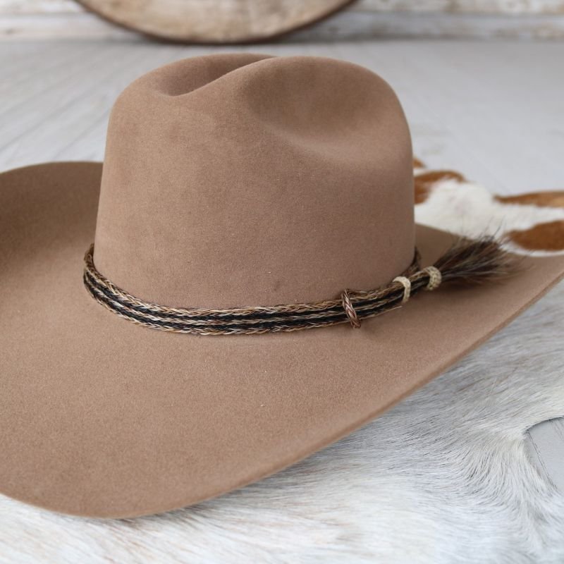 Tan felt hat with braided horsehair hat band and small single tassel